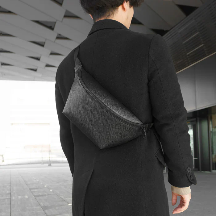 A person carrying a HushTug curved body bag
